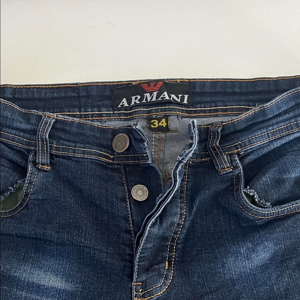 Armani Capri Button fly jeans. Size 34
$15